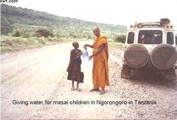 2002 - giving water to a Masai child at Serengeti.jpg